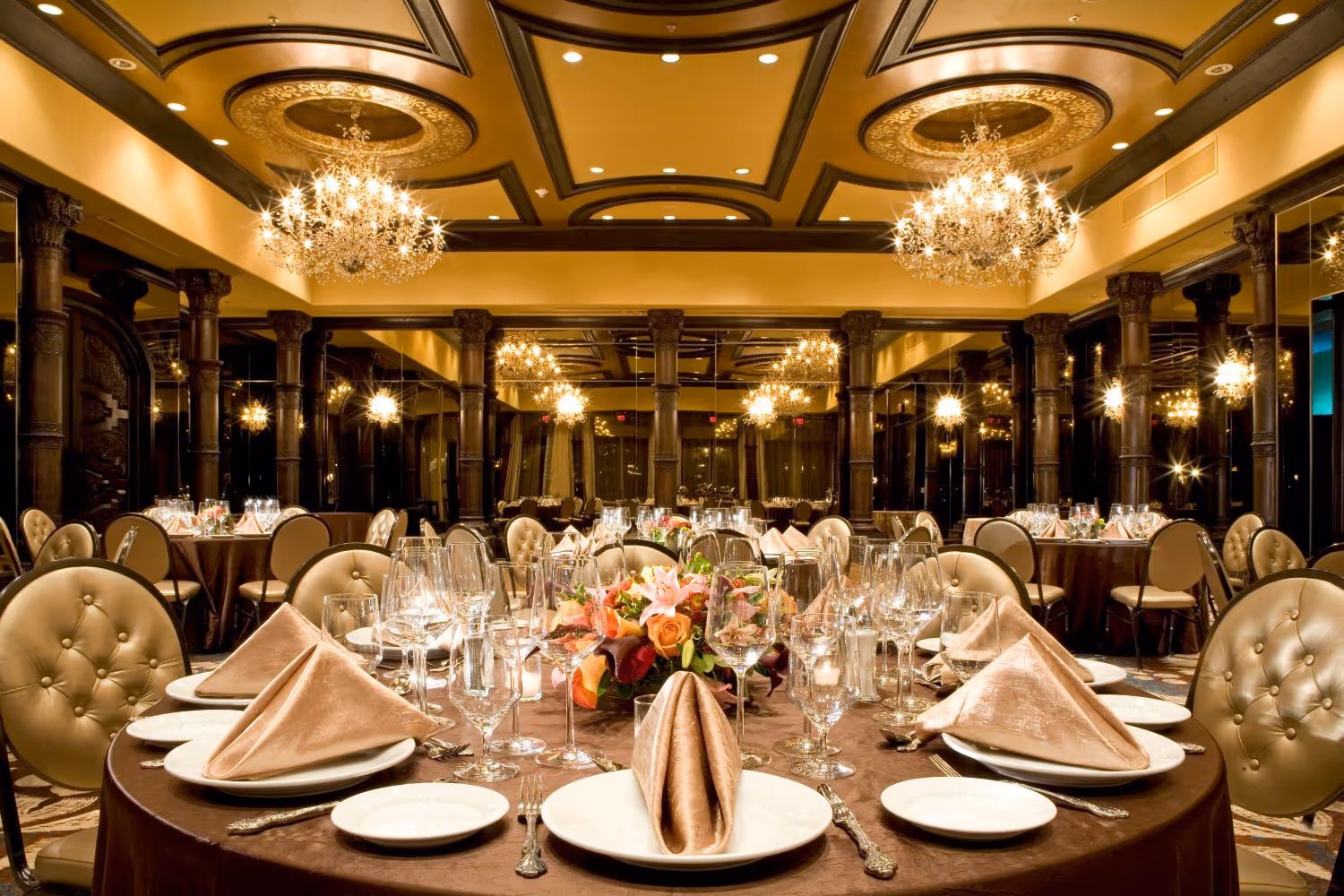 Ballroom set for an event with round tables and chairs