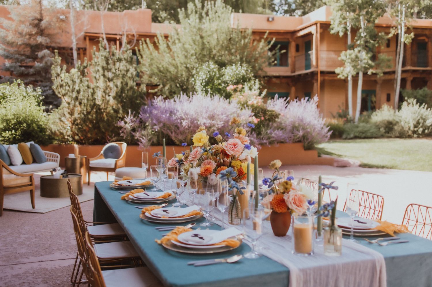 Tablescape outside set for a wedding with colorful flowers