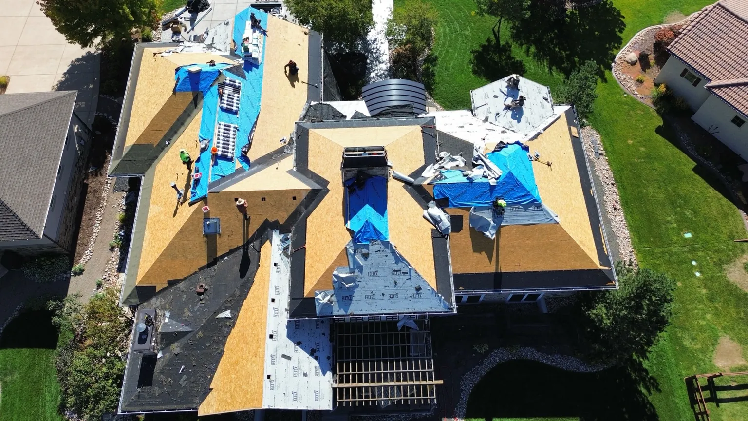 Roof decking exposed during the roof replacement at a Harmony Country Club home in Timnath.