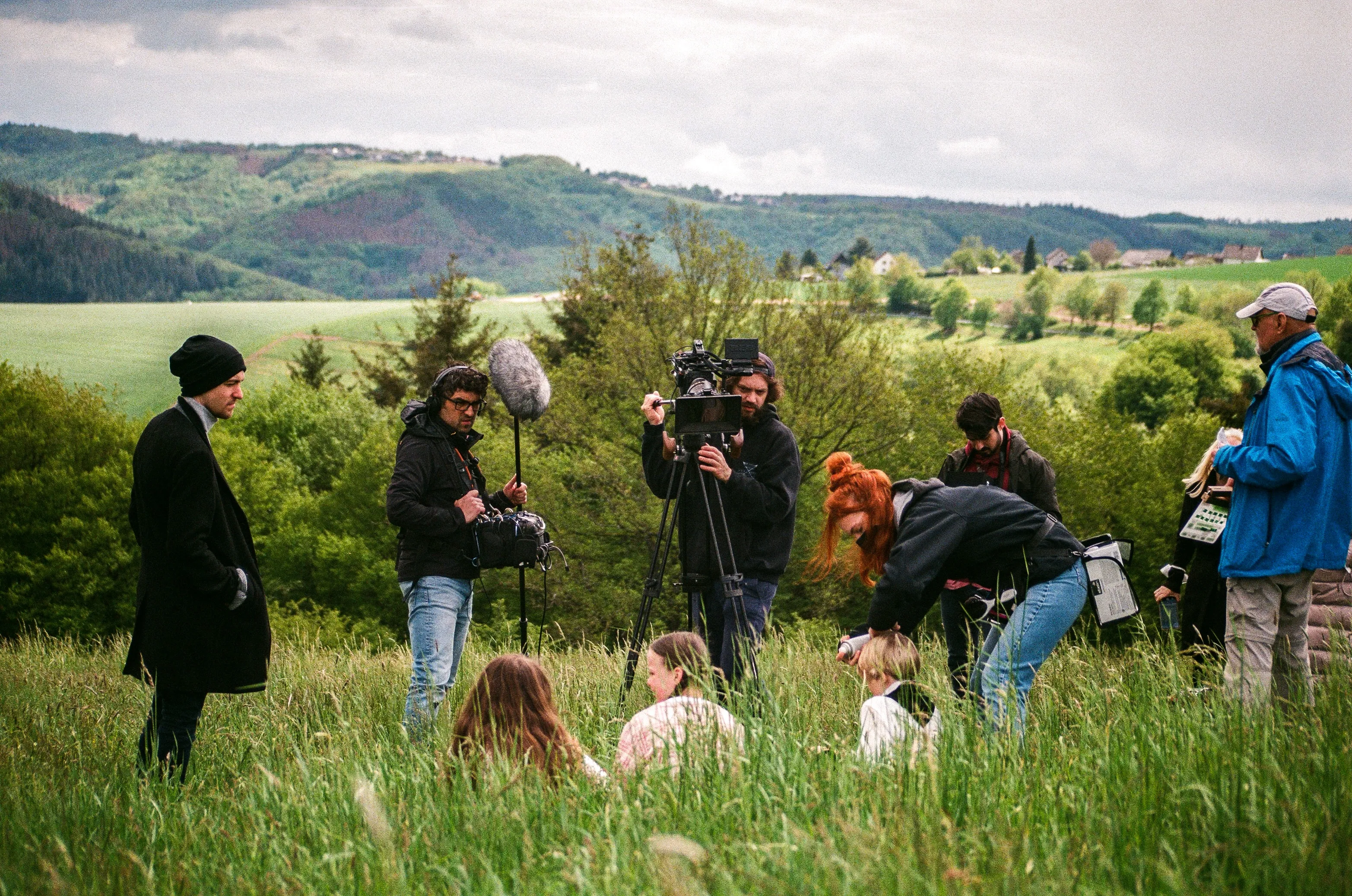 People filming a production on a set outside