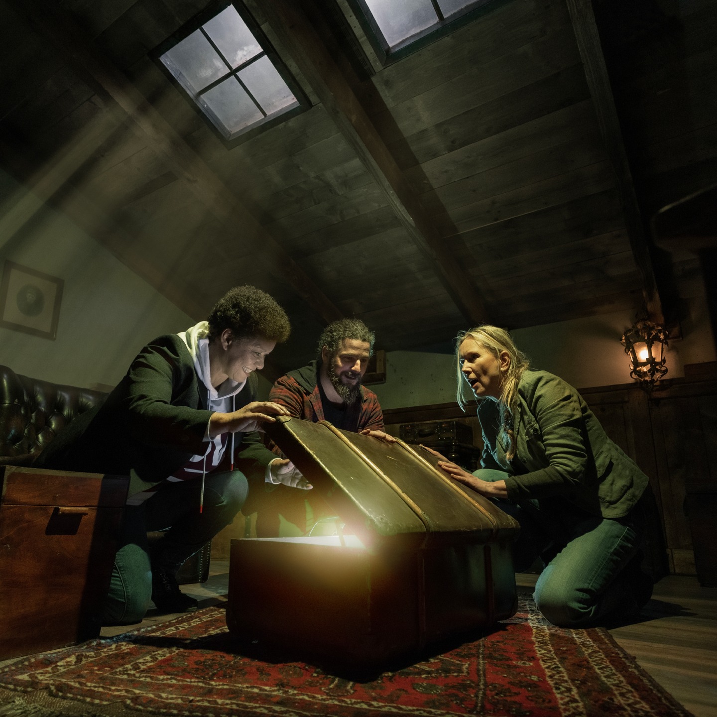 Three players opening a glowing chest in the attic of Sherlock's Brain Fog