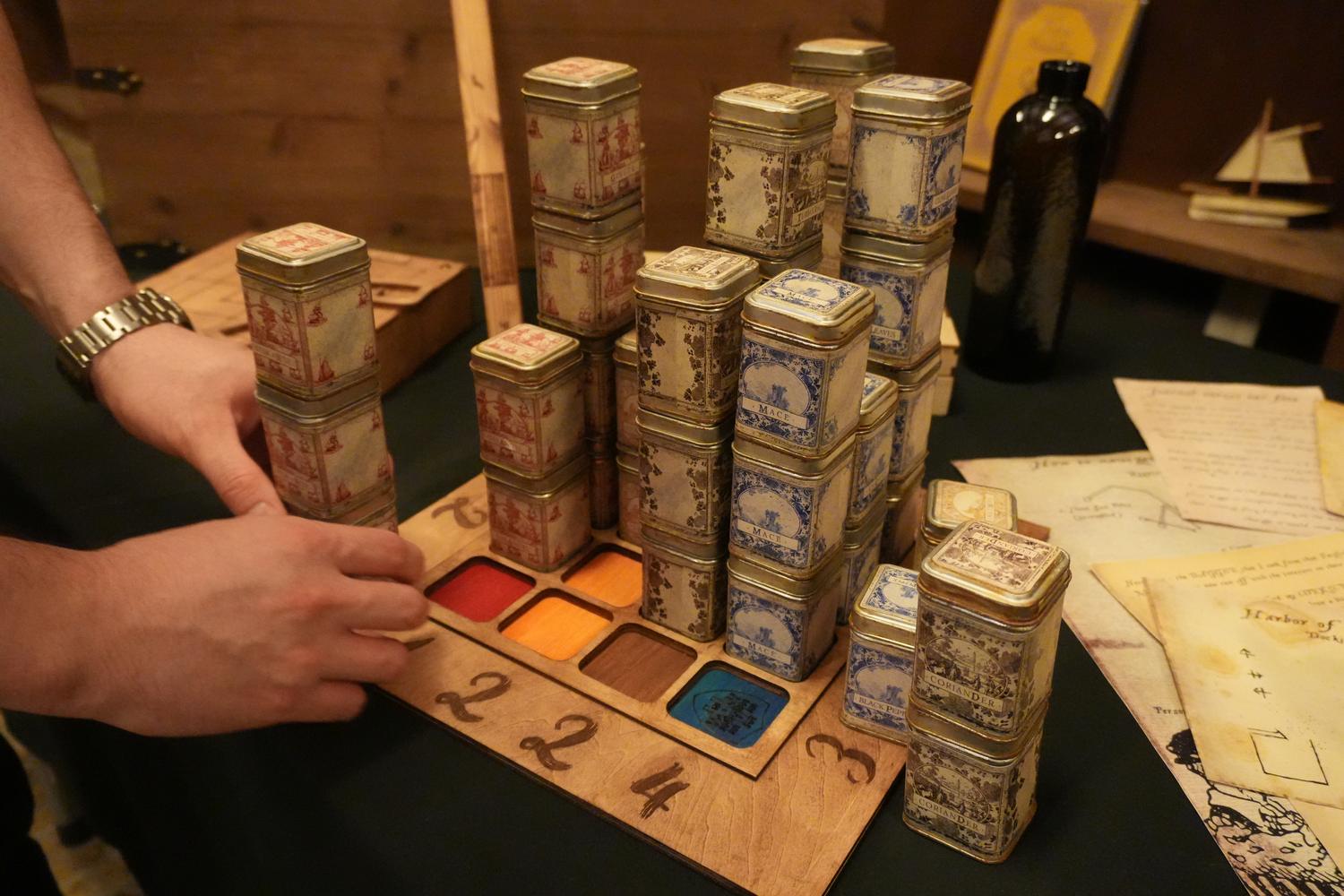 Hand-labelled spice tins stacked into a tower