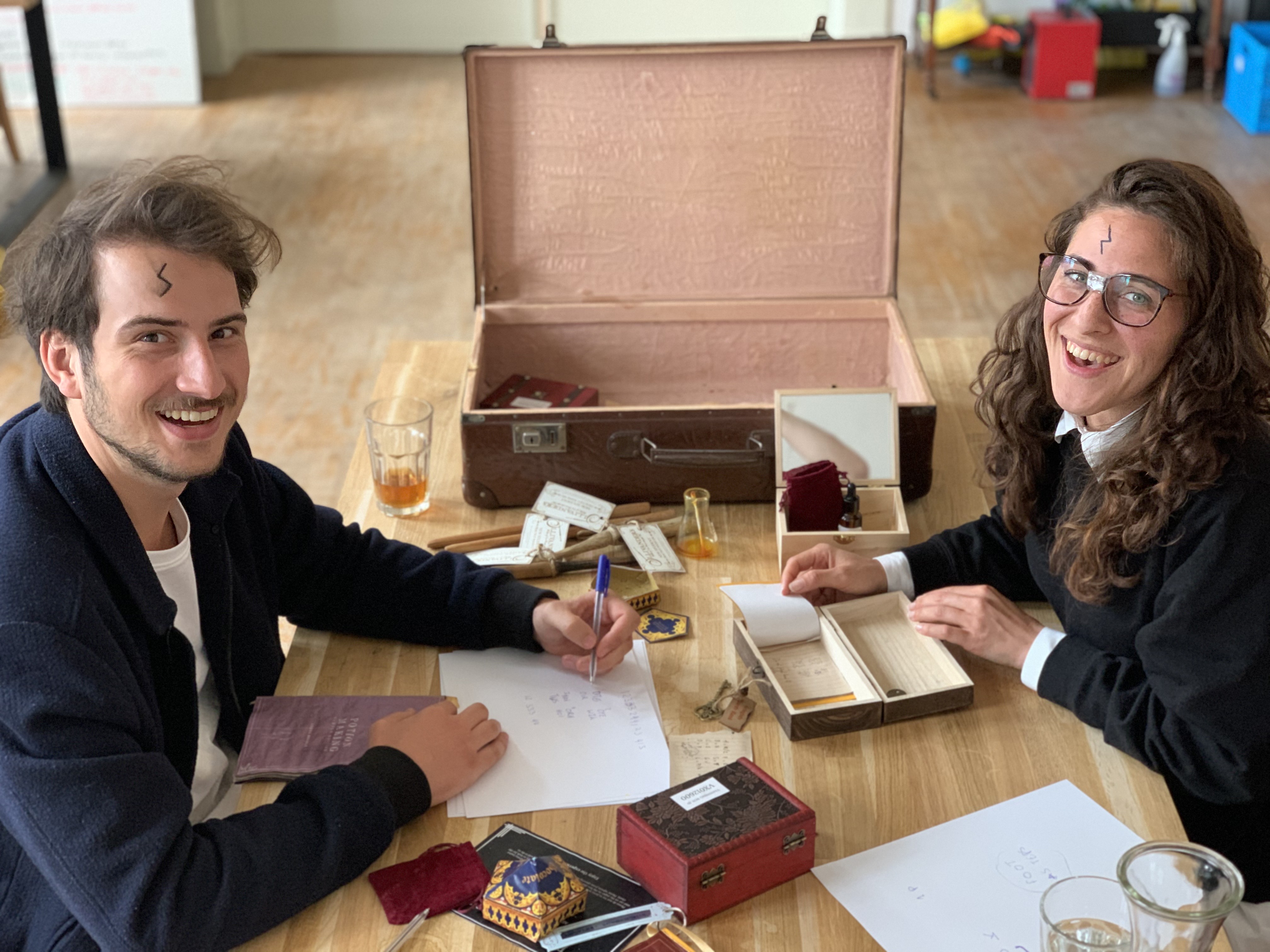 two people with Harry Potter tattoo playtesting a puzzle for an escape room in Amsterdam