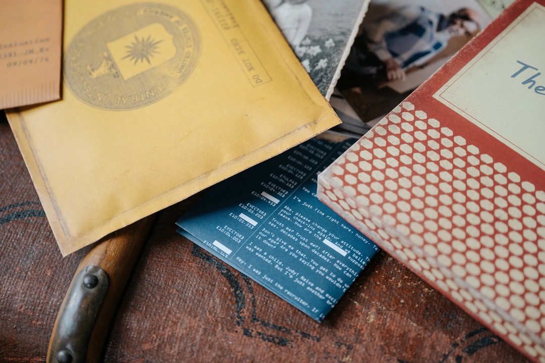 The Medusa Report game contents featuring a CIA dossier, evidence logs, and vintage ephemera