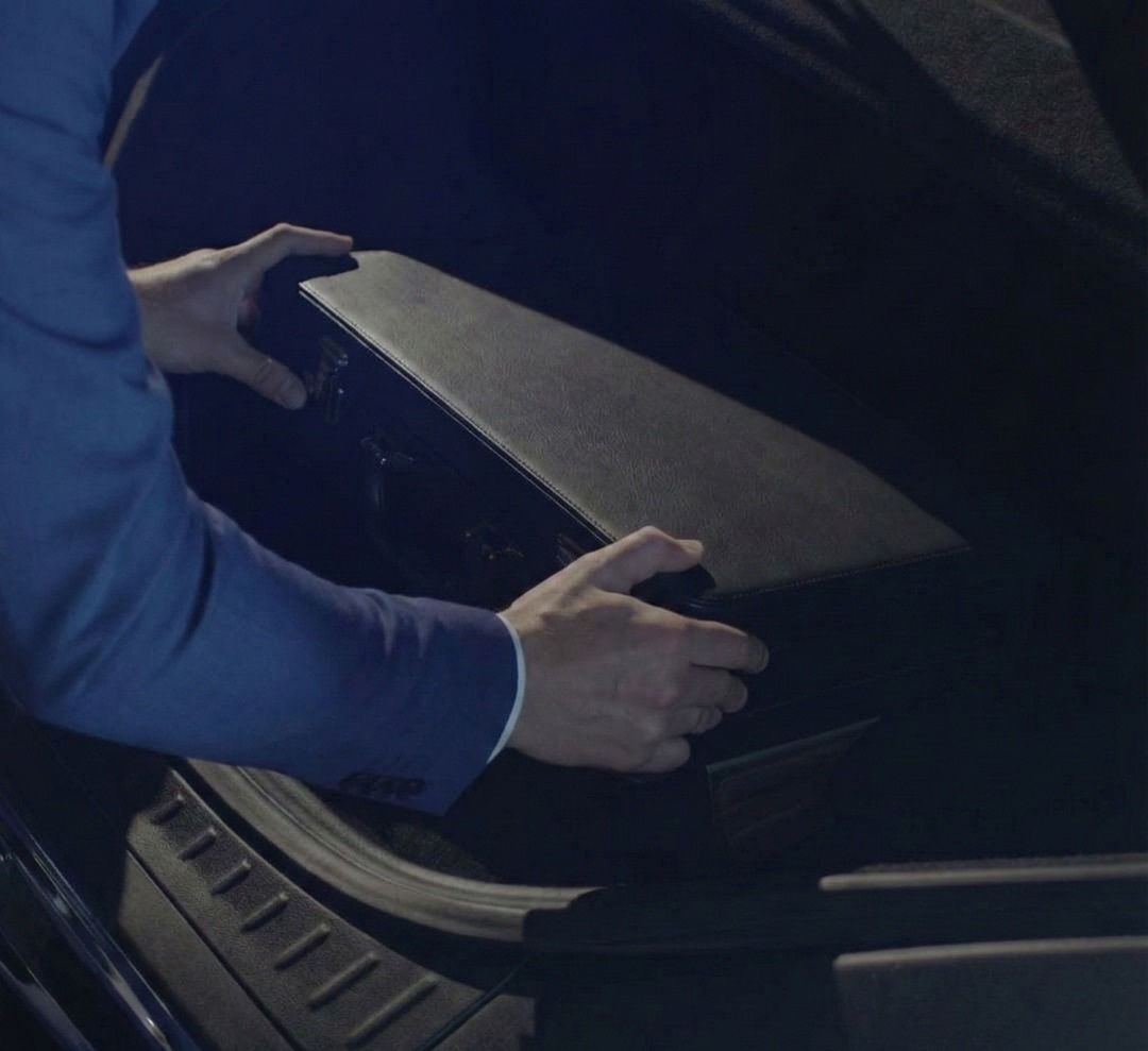 opening a suitcase in a parking garage in amsterdam before playing the vault escape room