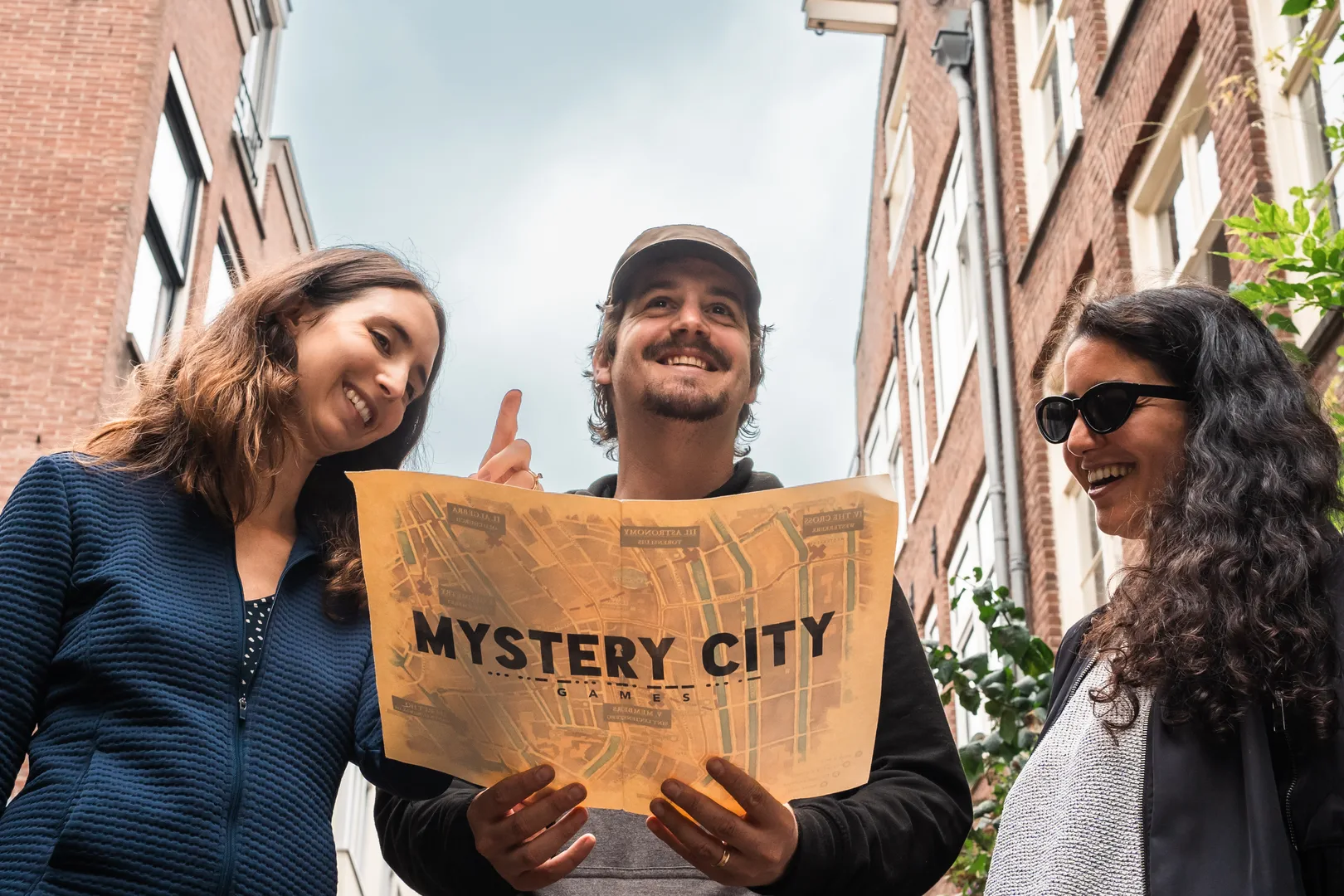 three people playing a mystery city game in Amsterdam 