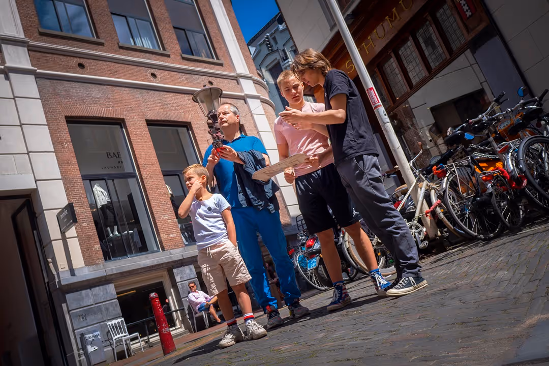 People playing a city game in Amsterdam from Sherlocked: Atlantis Protocol
