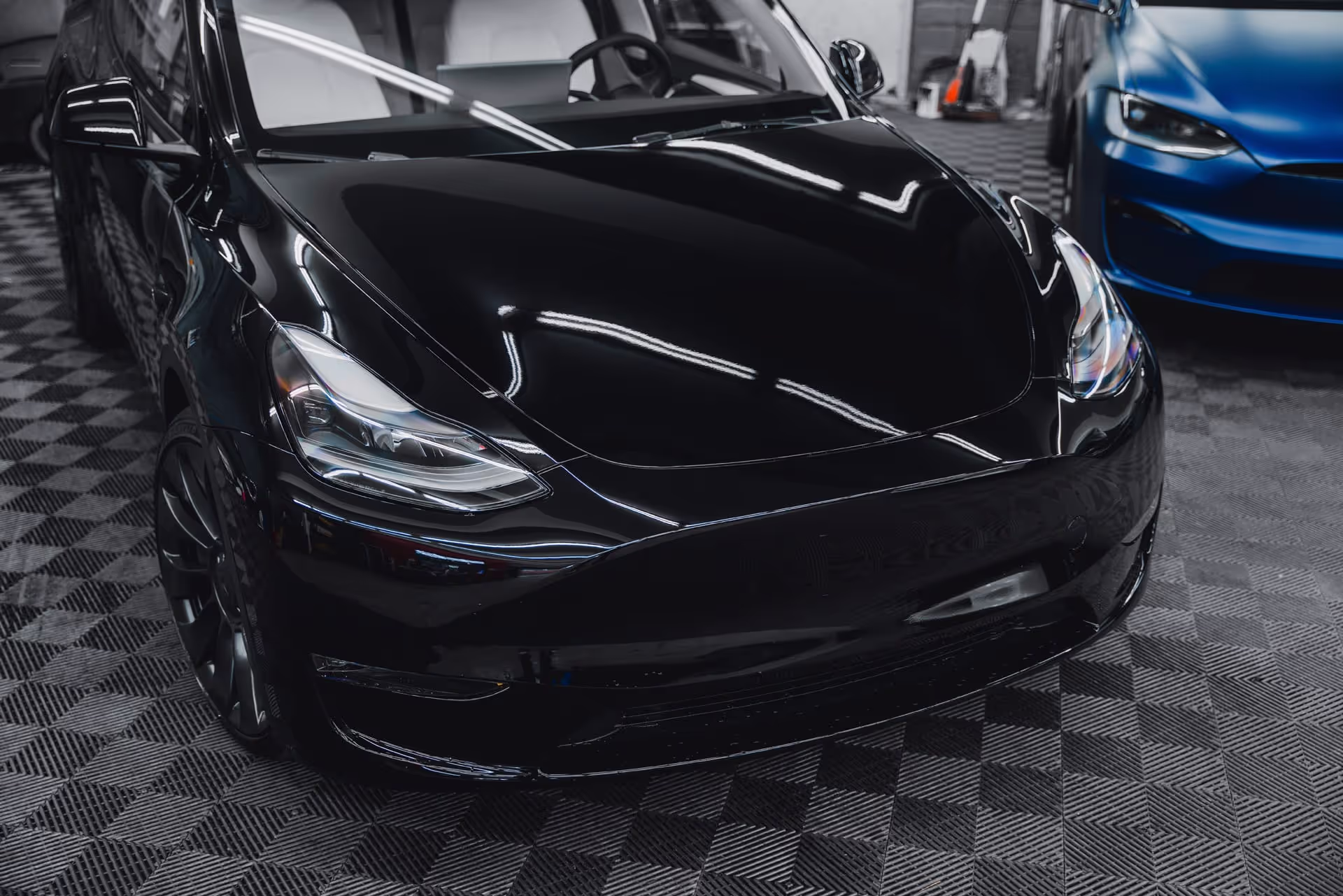 black tesla car in garage