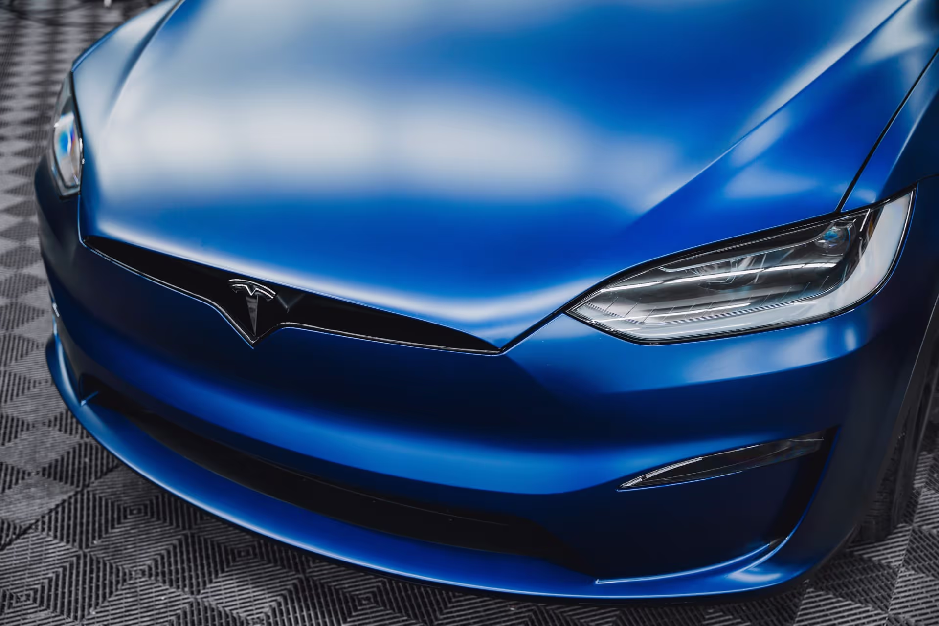 front of blue tesla