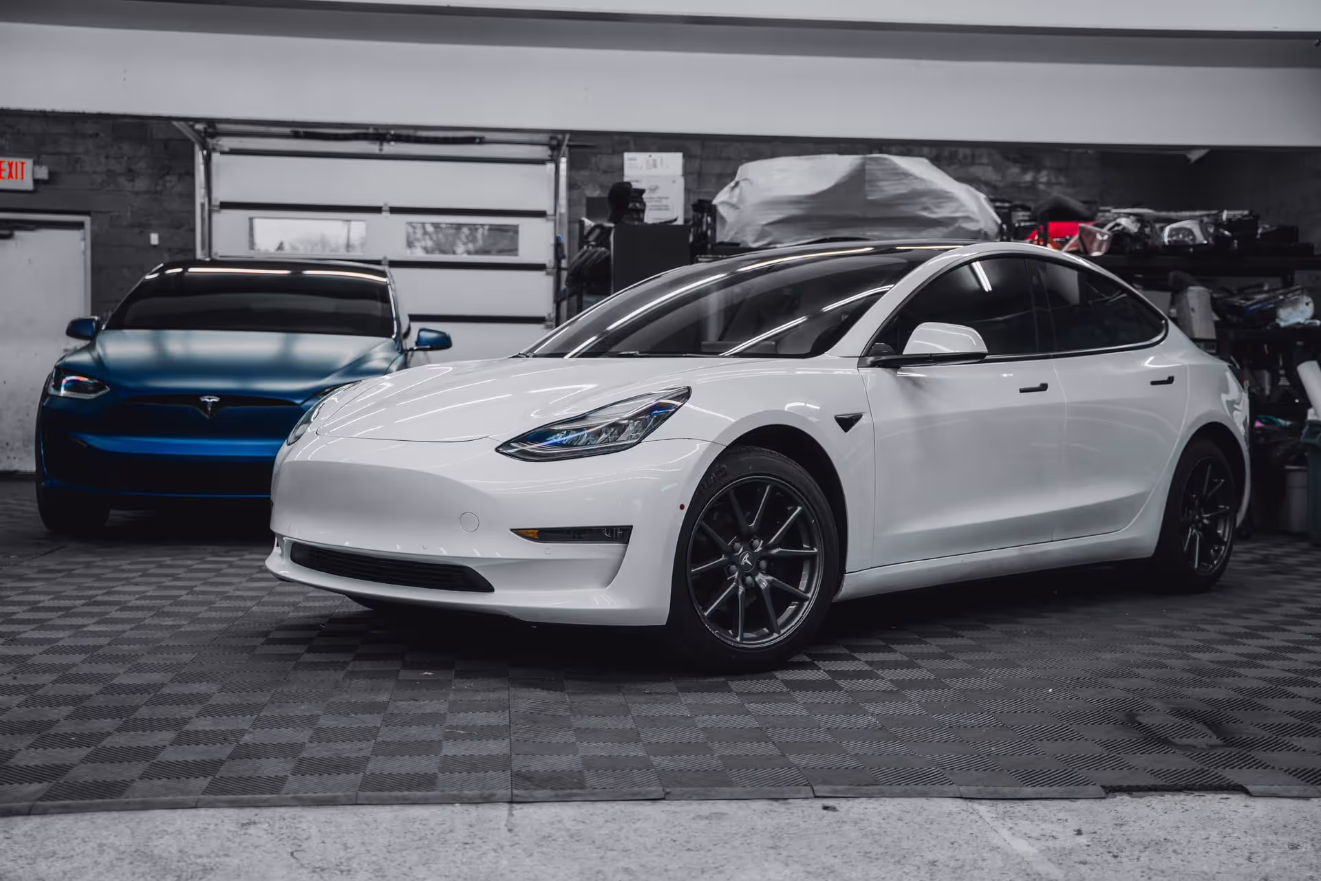 white teslacar in garage