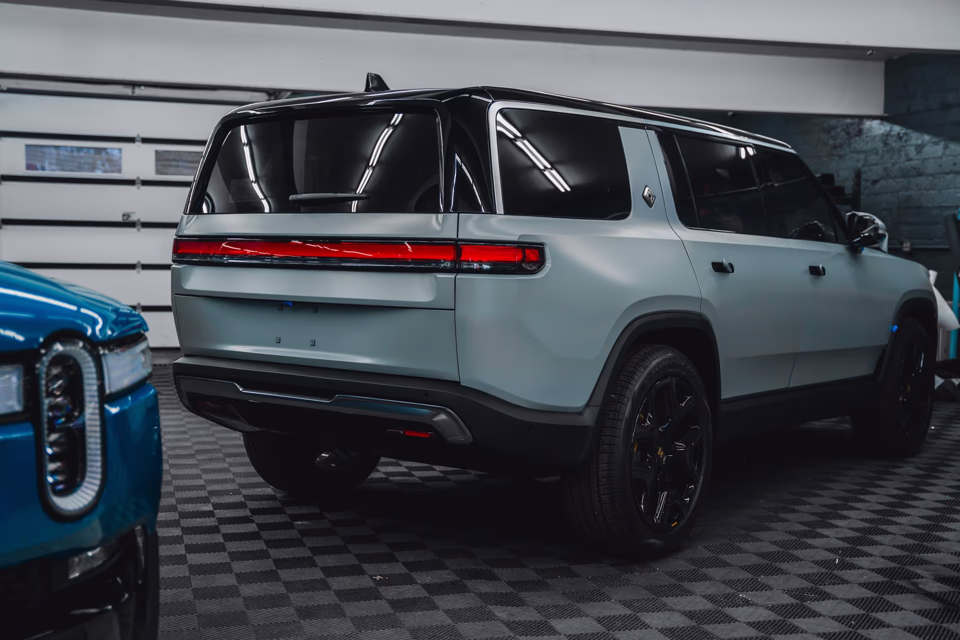 big sky blue car in garage