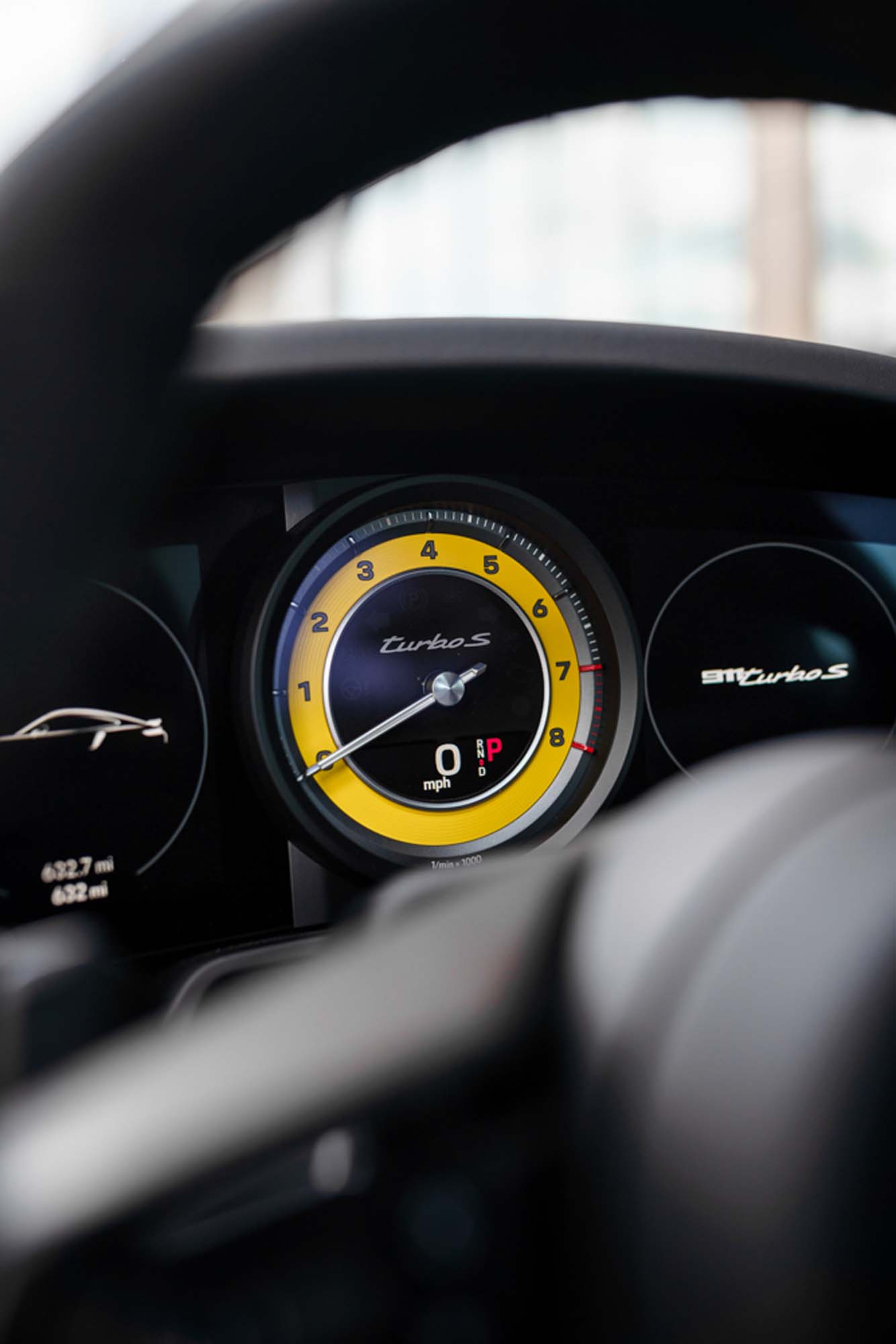Yellow-faced tachometer in the Porsche 911 Turbo S gauge cluster
