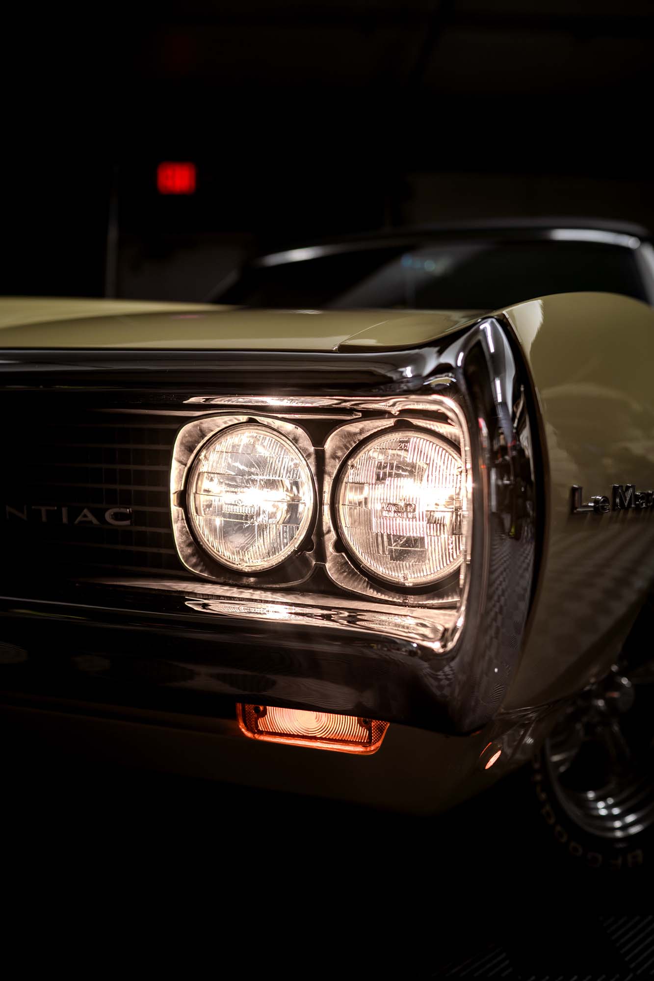 Dual headlights on the gold Pontiac LeMans