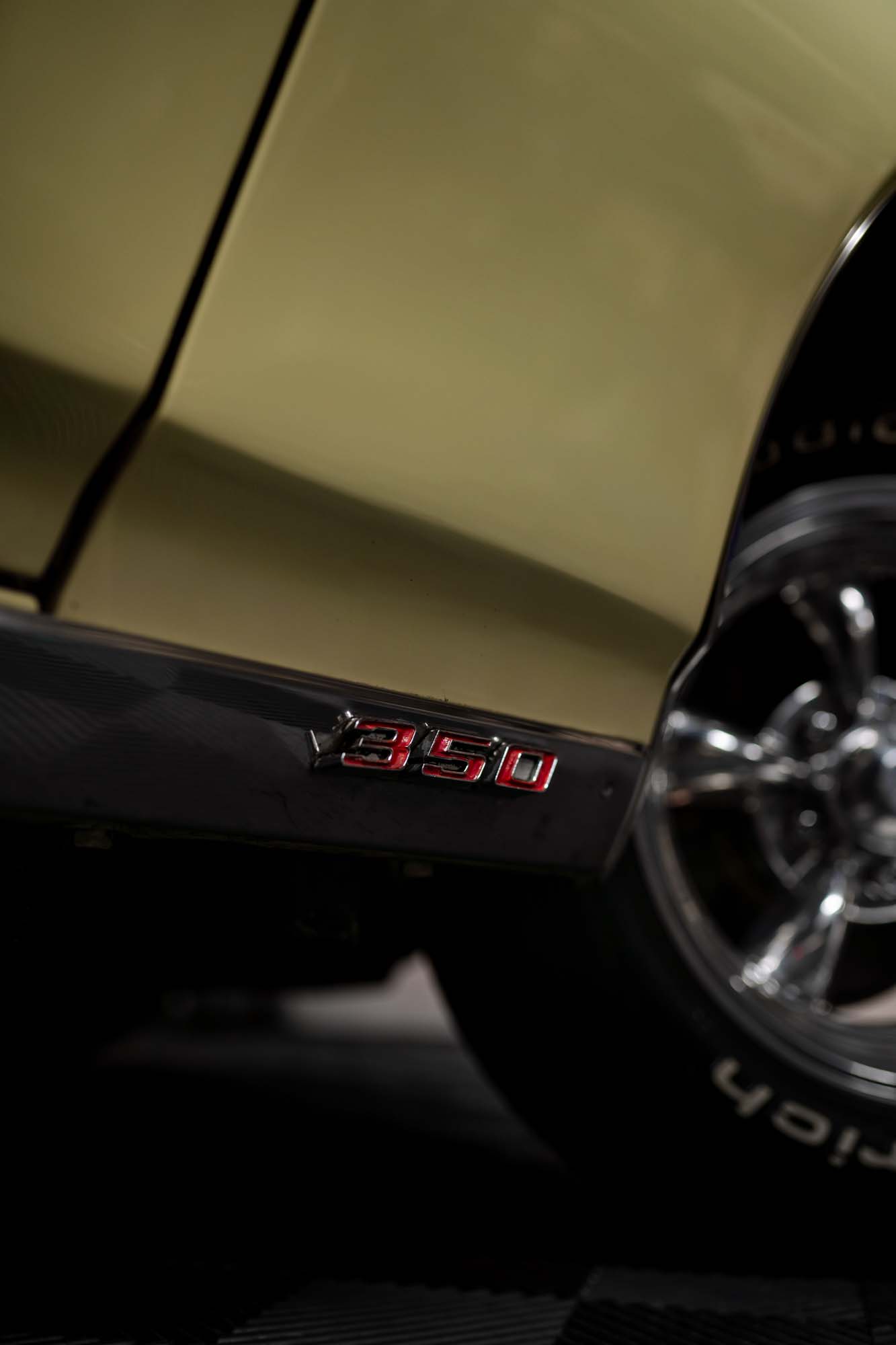Lower fender badge on the gold Pontiac LeMans