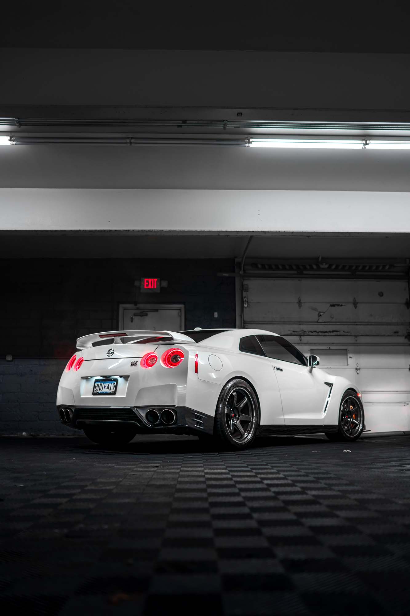 Rear three-quarter view of the white Nissan GT-R