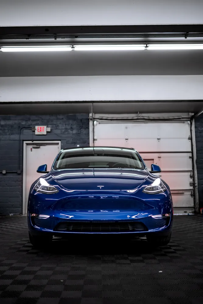 Blue Tesla Model Y with paint protection film and ceramic coating at Pristine Detail