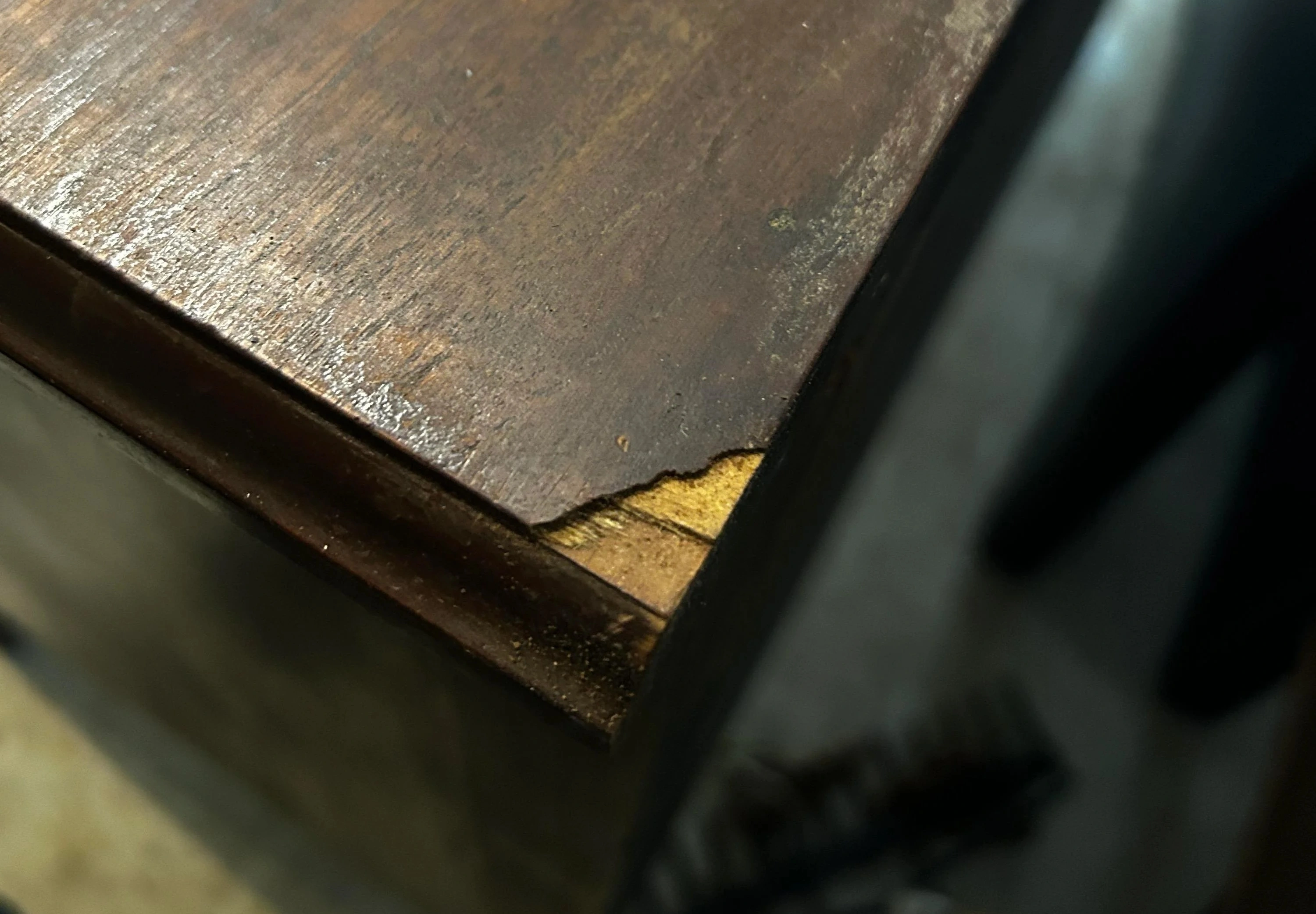 A chip on the corner of the dresser during a DIY move.