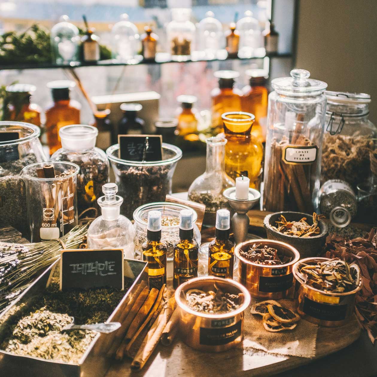 herbs, oils, and other natural ingredients in glass containers