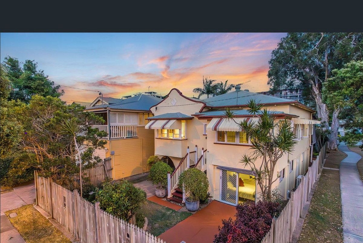 Renovated Highset Queenslander with Deck & Dual Living Areas - Moments From The Waterfront