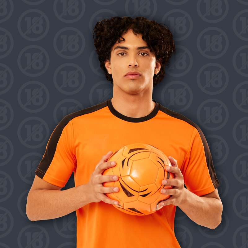 A young Maker of Tomorrow holding a soccer ball