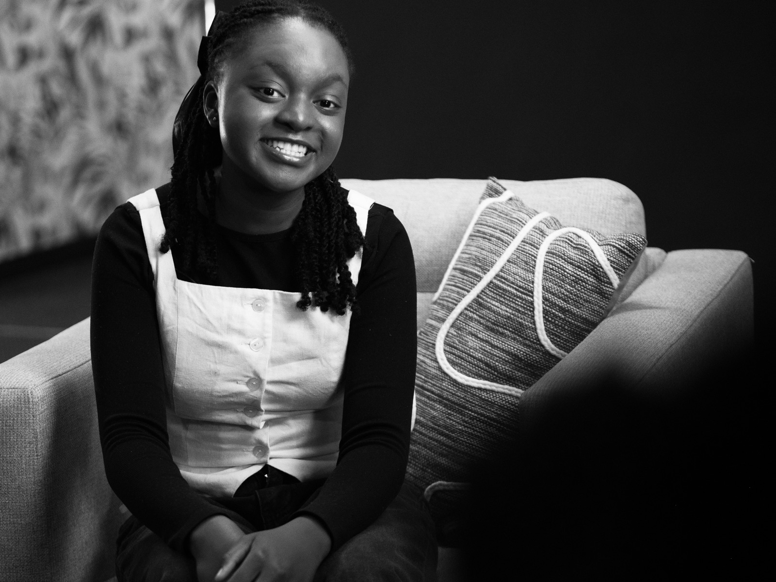 Tinyiko Matlala, smiling, seated in an armchair