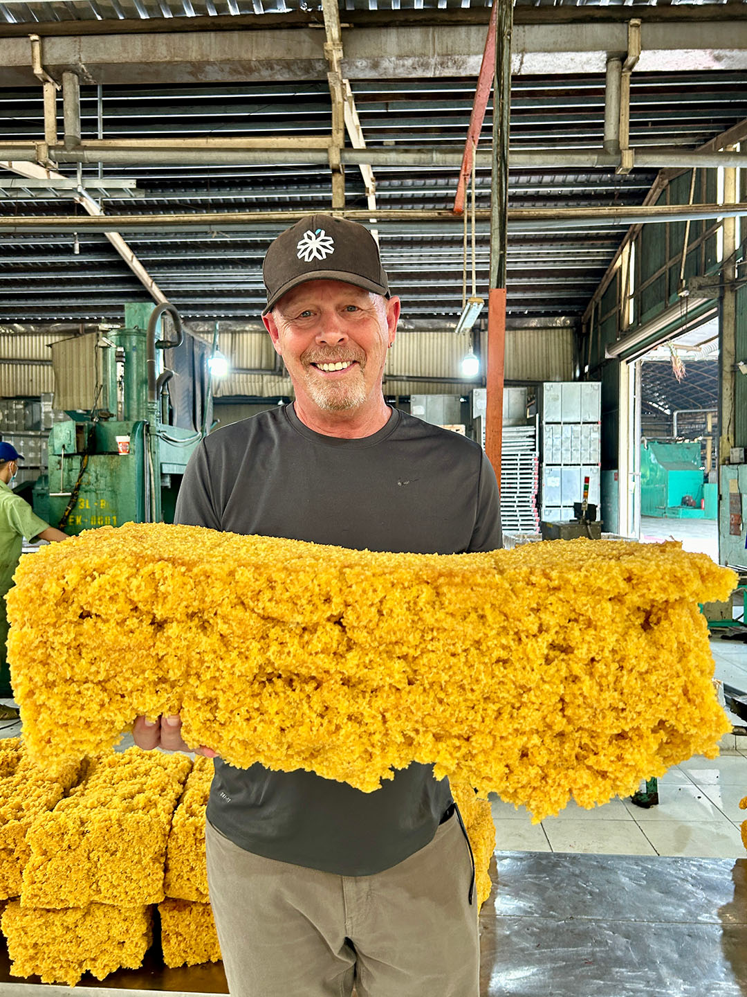 women holding block of foam