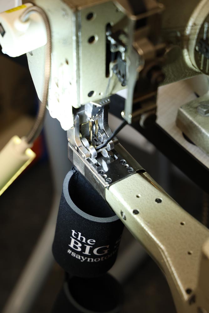 A koozie being made
