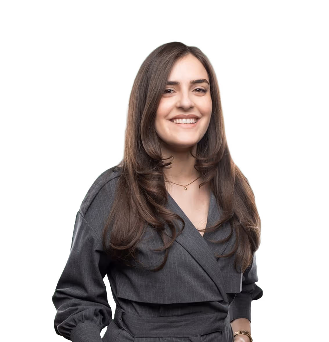 A smiling woman with long brown hair, wearing a dark gray wrap dress and a delicate necklace.