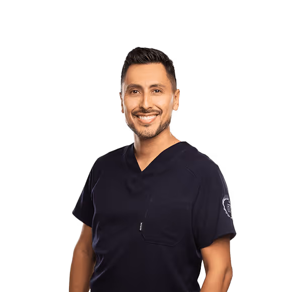 A smiling healthcare professional, wearing a dark lab coat, stands out against a transparent background.