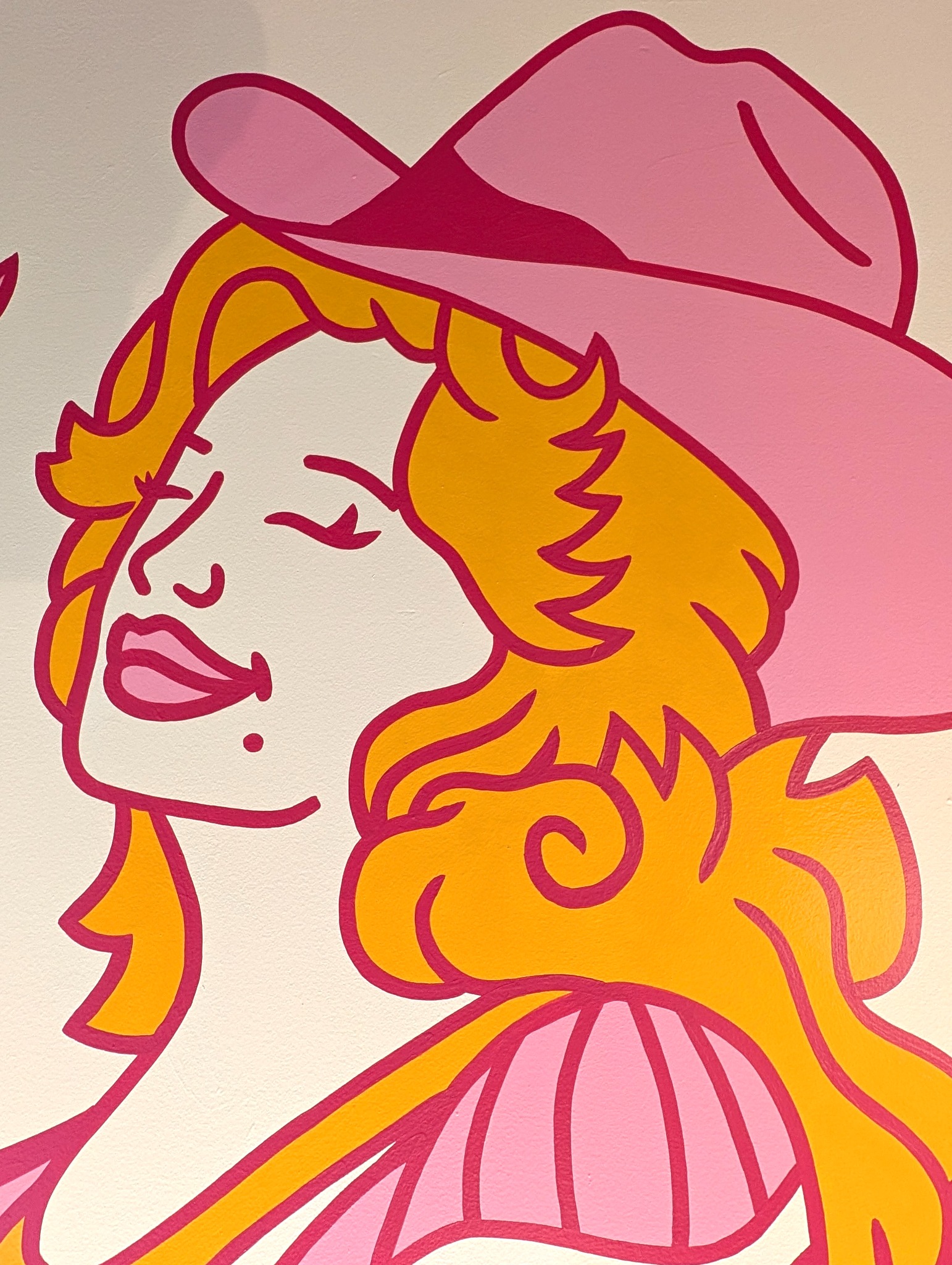 Close-up of the cowgirl-inspired figure in Brianna Gardocki’s Jolene Jolene of Hearts mural