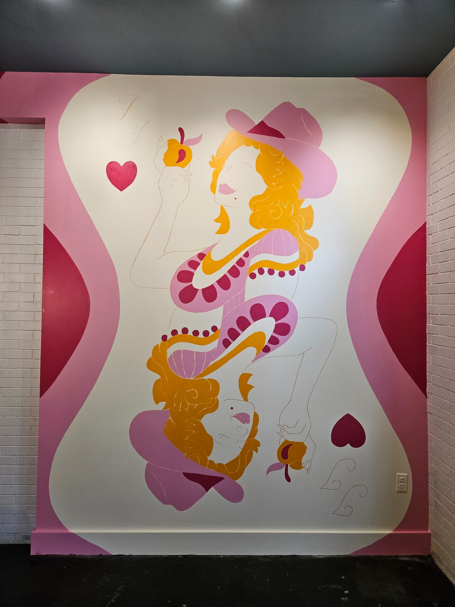 In-progress Jolene Jolene mural showing the character, hearts, and surrounding color fields