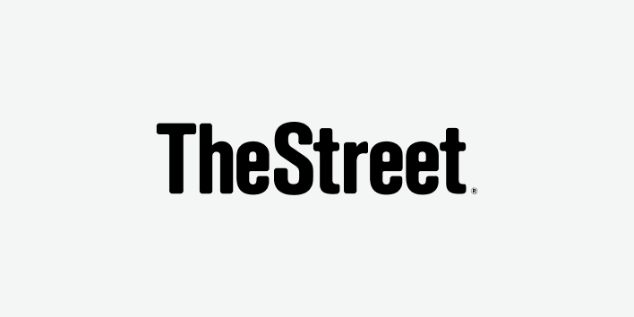 TheStreet wordmark in bold black type on a light gray background.