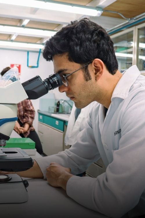 A man using a microscope