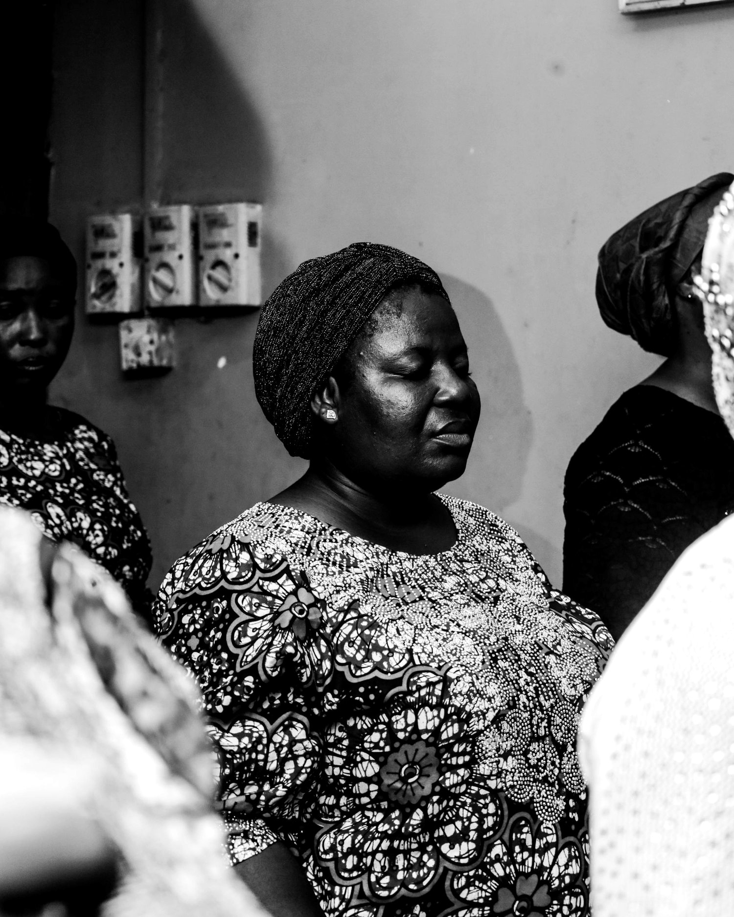 Candid black and white portrait of women gathered together in Lagos
