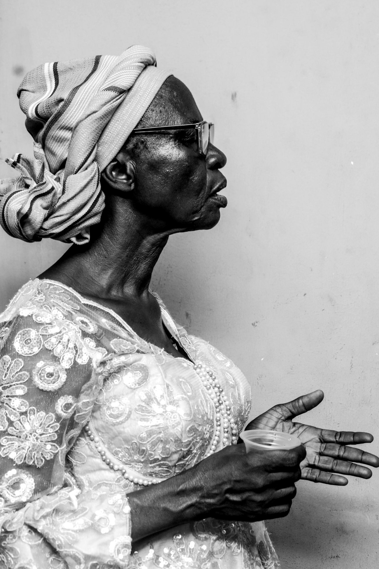 Black and white portrait of an elderly woman in traditional dress