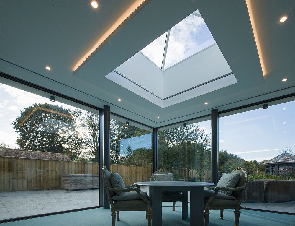 Modern interior without window treatments by Grants Blinds