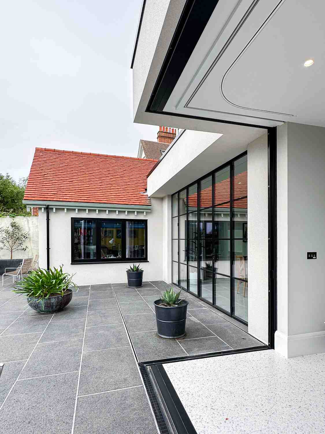 Bright conservatory without close up blinds on large windows by Grants Blinds