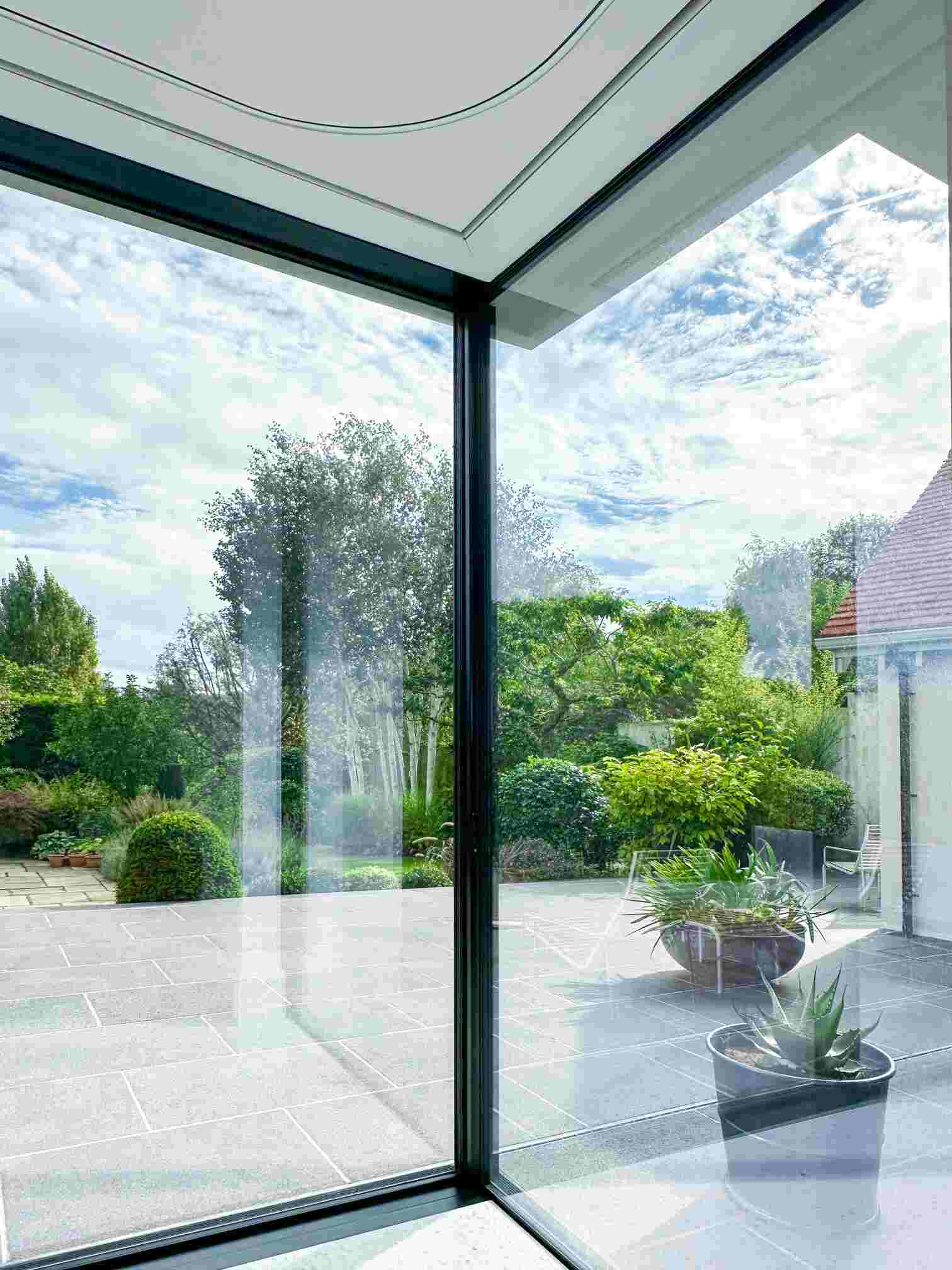 Modern interior without window treatments by Grants Blinds