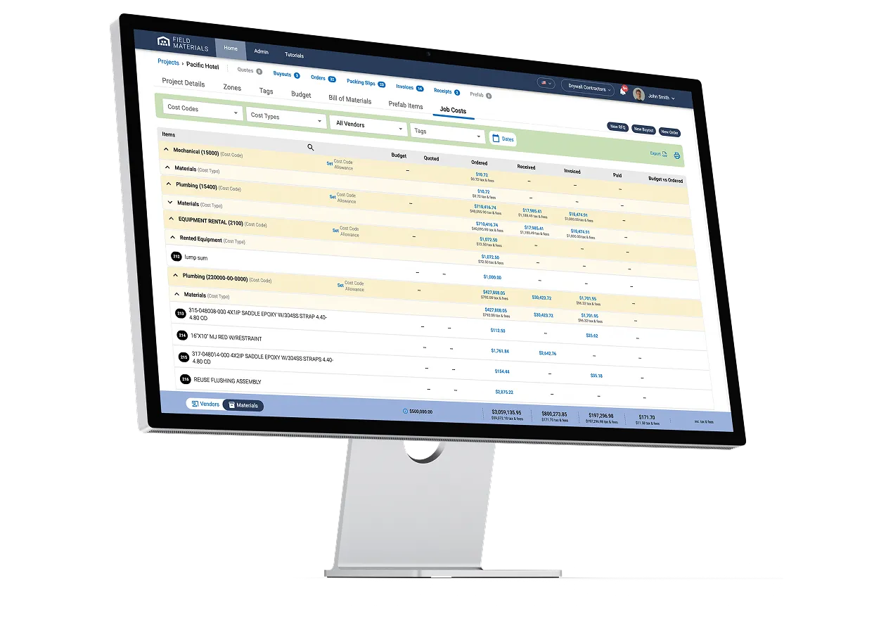 A computer monitor displays a project management dashboard with a list of cost codes, names, budgets, and related financial details.