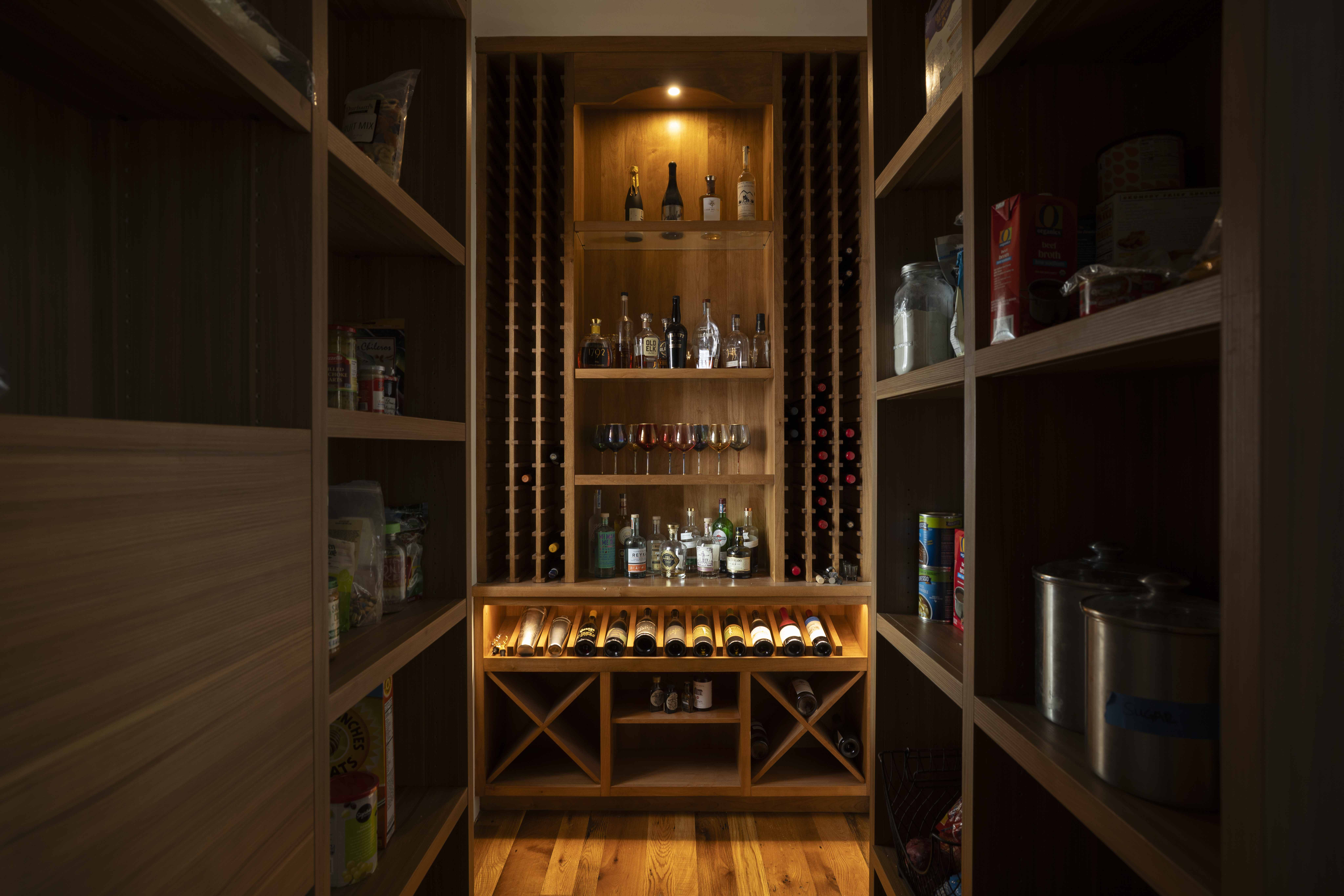 Wine room with lit shelving