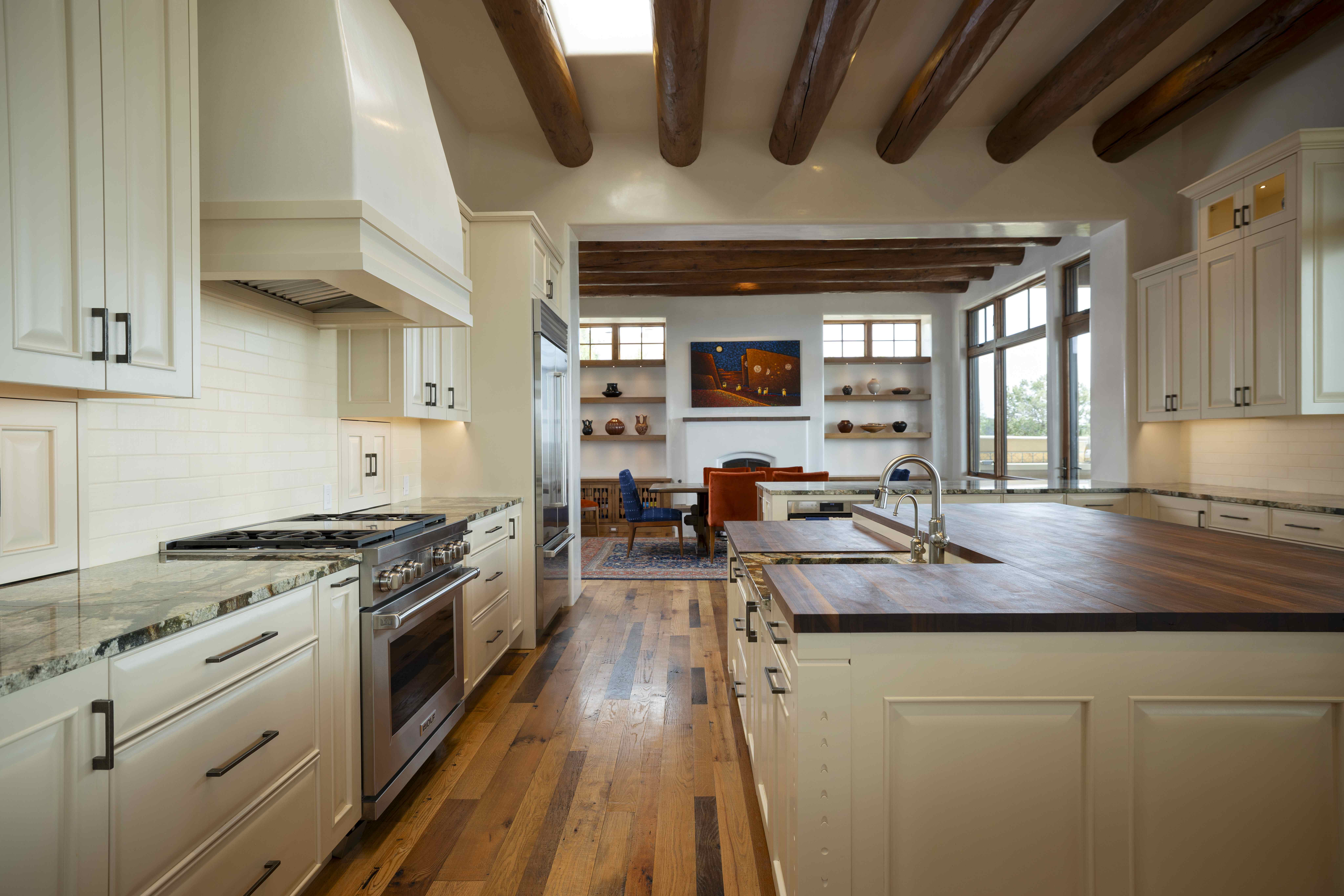 Kitchen island and range under vigas