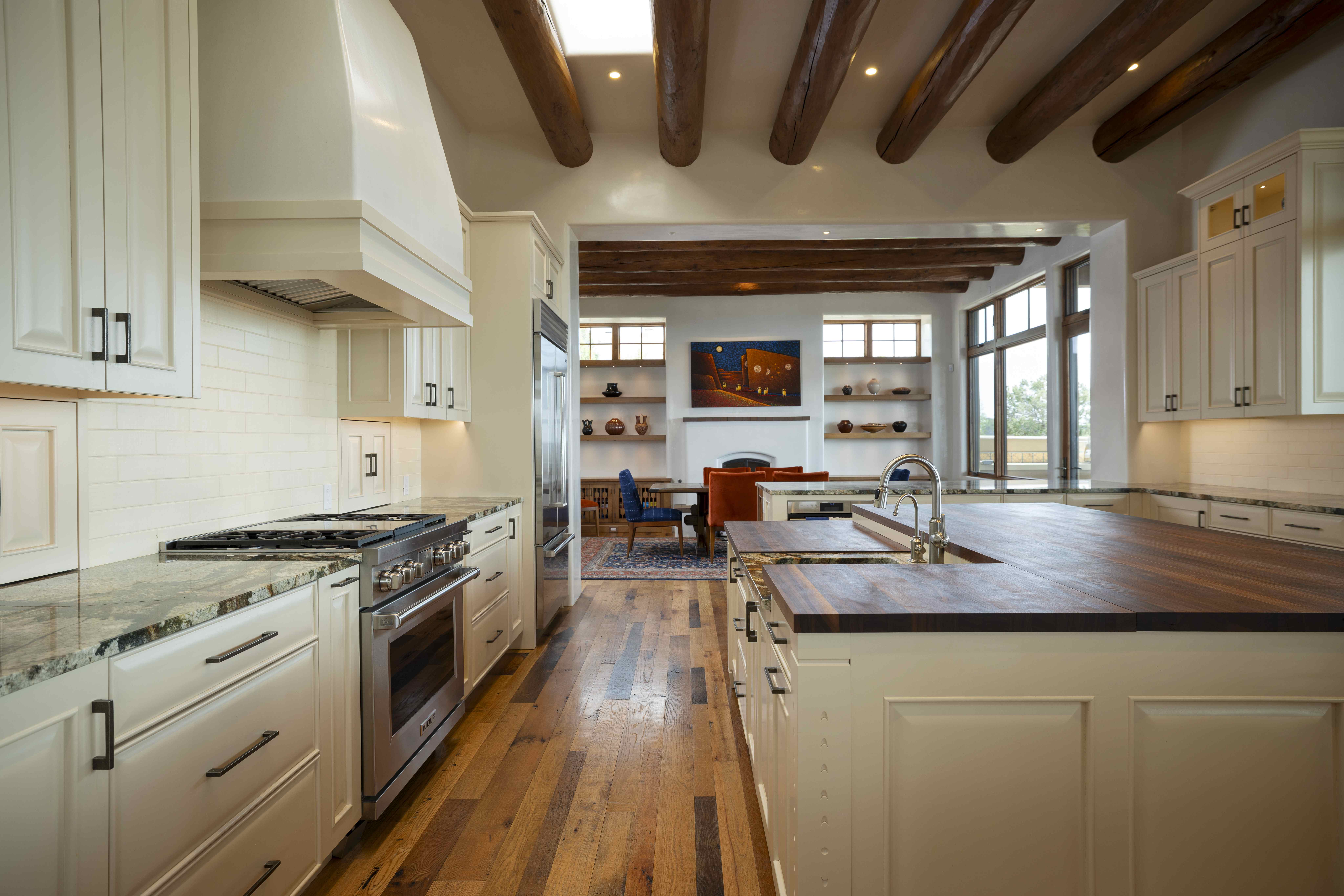 Kitchen with beamed ceiling and wood floors in a traditional New Mexico home