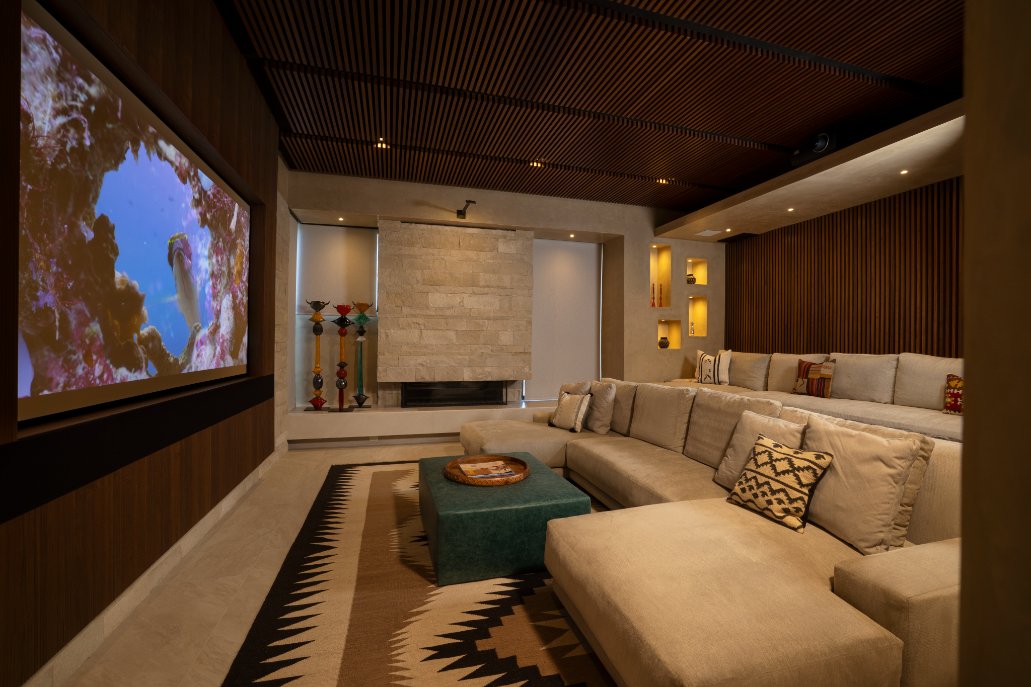 Home theater with large projection screen and sectional sofa