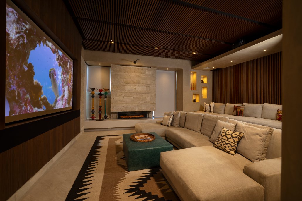 Home theater with large projection screen and sectional seating