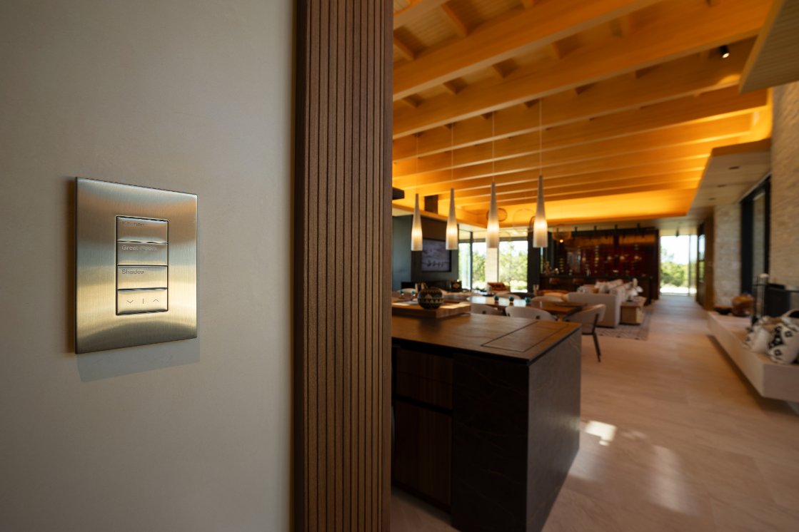 Brushed-metal lighting keypad beside the great room
