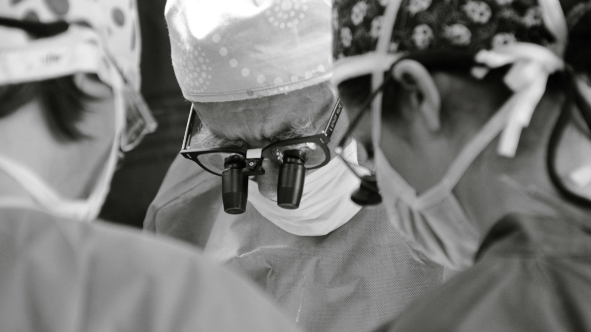 An artistic picture of surgeons operating on a patient.