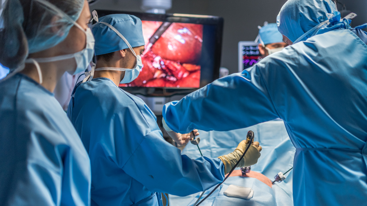 A picture of surgeons performing surgery in a hospital.