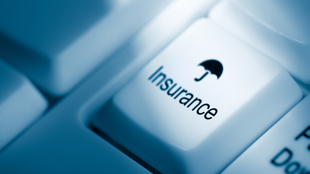 An image of the word "insurance" on a keyboard indicating to get insurance online.
