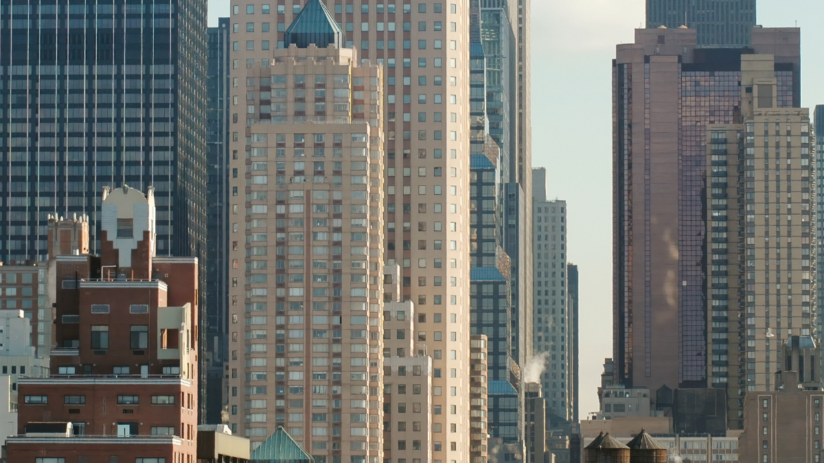 Close-up view of skyscrapers and buildings in a city under daylight.