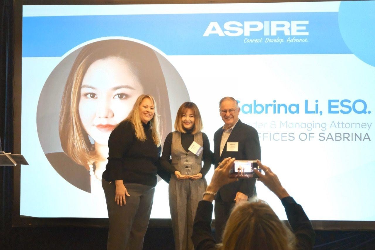 A group of people standing on stageAI-generated content may be incorrect.